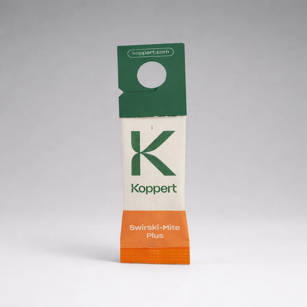 A small paper sachet labeled “Amblyseius Swirskii Prevention Sachets” with a green top, orange bottom, and koppert.com stands upright against a plain gray background. The sachet features a hanging hole for easy use in thrips control.
