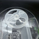 Close-up of a clear humidity dome on a nursery pot, featuring optimal drainage holes for seedling and plant propagation.