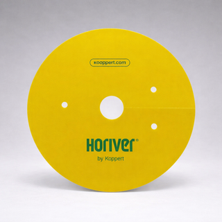 A round, yellow Horiver Professional Sticky Trap by Koppert with three small holes and a central hole stands upright against a plain gray background. "koppert.com" is printed at the top. Designed for pesticide-free Integrated Pest Management.