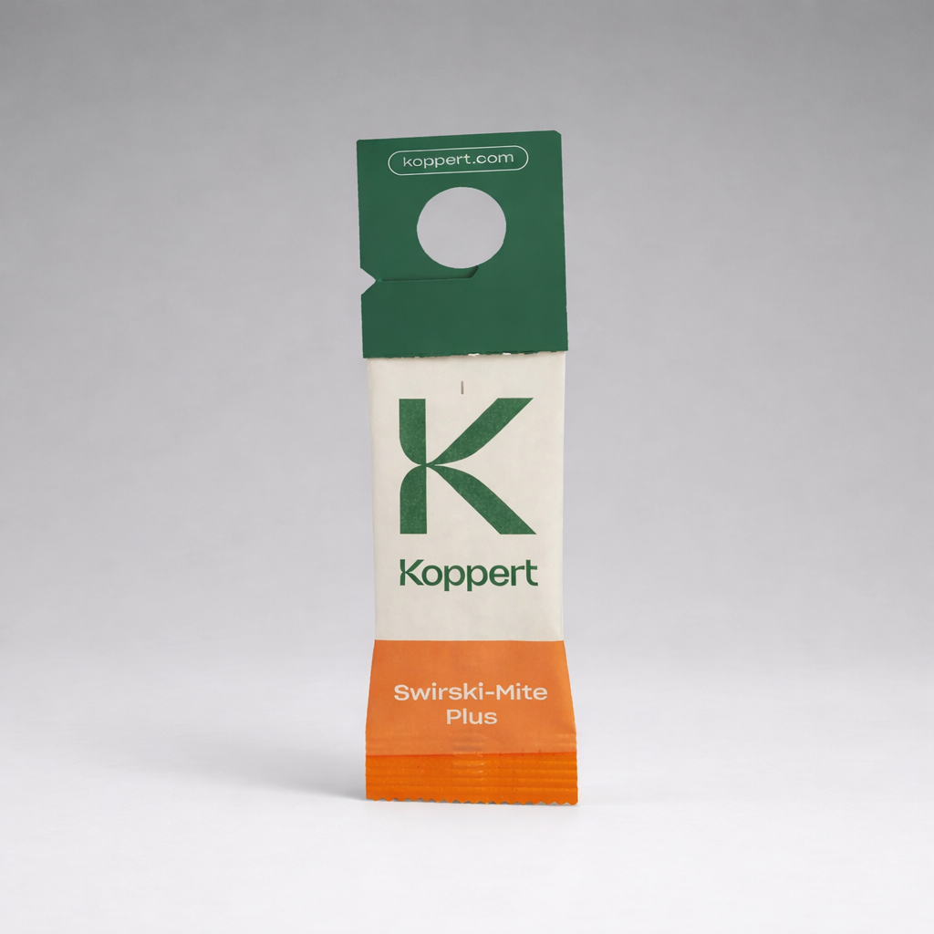 A small paper sachet labeled “Amblyseius Swirskii Prevention Sachets” with a green top, orange bottom, and koppert.com stands upright against a plain gray background. The sachet features a hanging hole for easy use in thrips control.