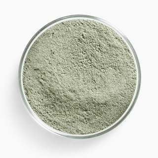 A glass dish of Trichoderma harzianum T-22 — a fine, pale green-grey powder.