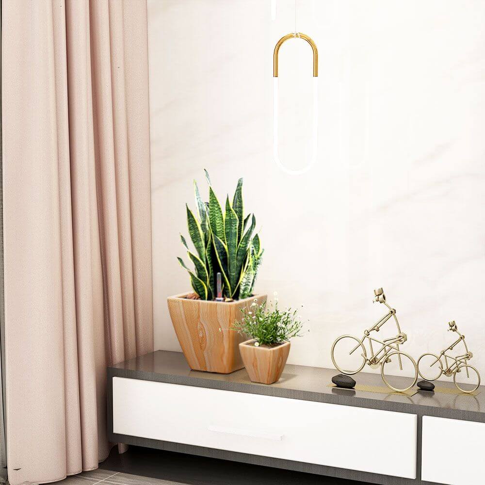 Light wood finish self-watering square planters with decorative plants on modern cabinet top, enhancing home decor.